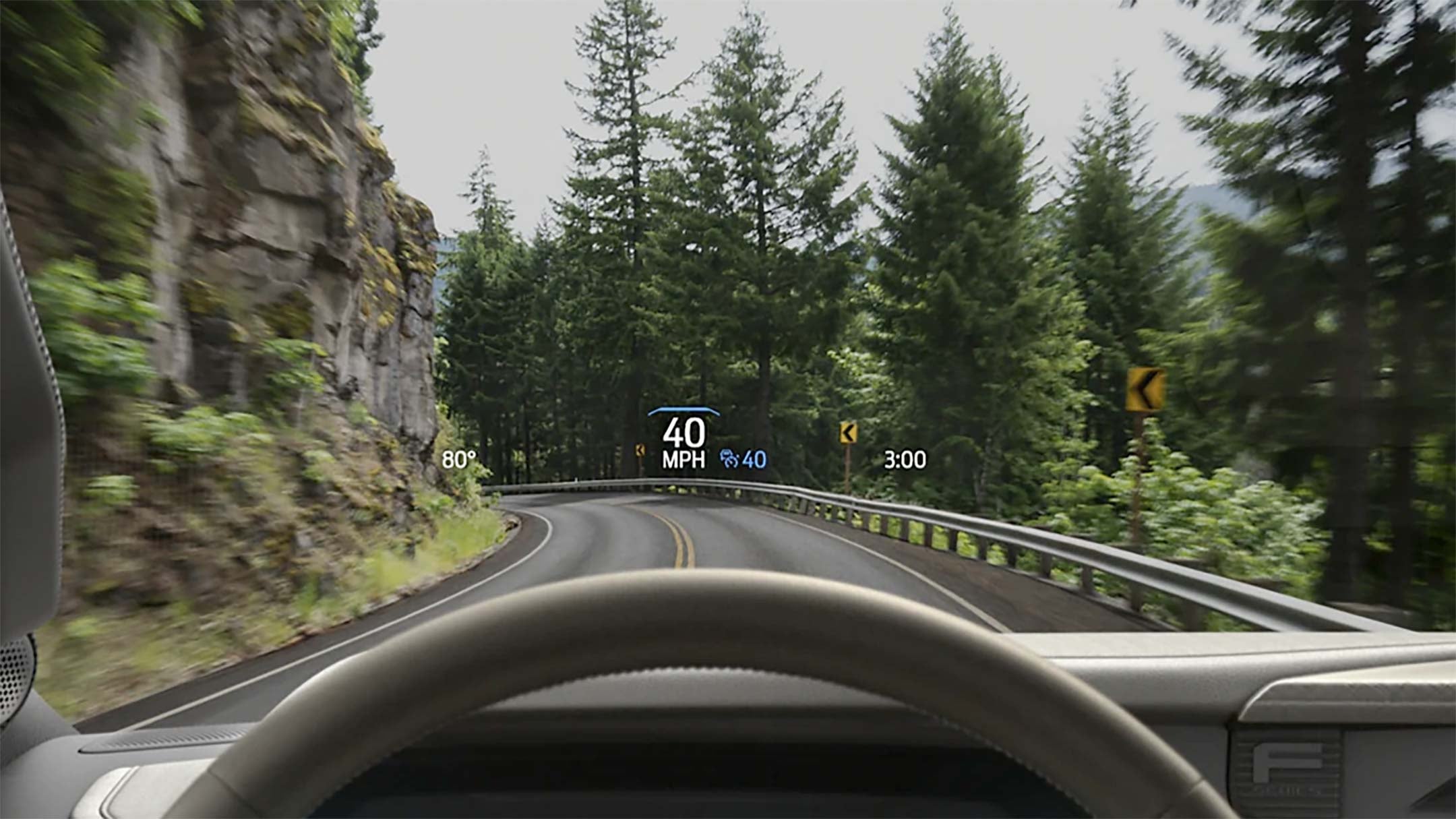 Driver perspective using head-up display feature highlighting the speed on to the windshield